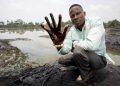 epa03556207 A undated image showing plaintiff Nigerian farmer Eric Dooh showing his hand covered with oil from a creek near Goi, Ogoniland, Nigeria. According to a report of UNEP (United Nations Environment Programme), leaks in Shell pipelines in Nigeria occur regularly, causing harm to communities in the Niger Delta region. A group of Nigerian plaintiffs claim Shell is liable for the damage the leaks caused, while Shell claims most leaks are the result of sabotage. Reports also state fishponds and farmland have been destroyed, while most locals have no other option but to drink from polluted water. Eric Dooh from Goi (Ogoniland), Alali Efanga from Oruma (Bayelsa) and Friday Alfred Akpan from Ikot Ada Udo (Akwa Ibom), individual farmers from three different communities in the Niger Delta, have taken Shell into the Dutch civil court of The Hague in a landmark pollution case, asking for compensation for damages to their land. The verdict in the case is due 30 January 2013.  EPA/MARTEN VAN DIJL