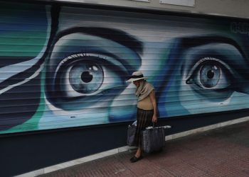 epaselect epa04808384 An elderly shopper passes by a closed shop  in central Athens, Grrece, 19 June 2015. With the world's eyes focused on the issue Eurozone finance ministers failed to find a breakthrough in the Greek bailout crisis, European Commission Vice President Valdis Dombrovskis said. 'Strong signal for Greece to engage seriously in negotiations.' Fears are mounting that cash-strapped Greece will soon go bankrupt. It is seeking to access 7.2 billion euros (8.2 billion dollars) remaining in its international bailout, but has been struggling for months to agree with its creditors on prerequisite economic reforms  EPA/YANNIS KOLESIDIS