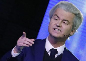 Right-wing populist leader Geert Wilders gestures during a national televised debate with Dutch Prime Minister Mark Rutte, the first head-to-head meeting of the two political party leaders since the start of the election campaign, at Erasmus University in Rotterdam, Netherlands, Monday, March 13, 2017. 
(Yves Herman POOL via AP)