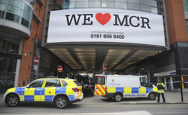 Police evacuate Arundel shopping centre near to the Manchester Arena in central Manchester, England Tuesday May 23 2017. Police confirmed that 19 people were killed in an explosion following a Ariana Grande concert at the venue late Monday evening.  (AP Photo/Rui Vieira)