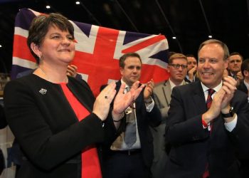 epa06017996 Democratic Unionist Party (DUP) leader Arlene Foster celebrates with her north Belfast candidate Nigel Dodds (R) after winning his Westminster seat at the Belfast count center in Belfast, Northern Ireland, Britain, 09 June 2017. DUP took north, east and south Belfast with Sinn Fein keeping west Belfast. British voters went to the polls on 08 June, to cast their ballot to elect a total of 650 Westminster Members of Parliament to form the next British Government, in a General Election called by British Prime Minister Theresa May.  EPA/PAUL MCERLANE