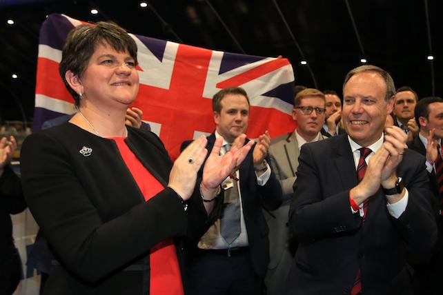 epa06017996 Democratic Unionist Party (DUP) leader Arlene Foster celebrates with her north Belfast candidate Nigel Dodds (R) after winning his Westminster seat at the Belfast count center in Belfast, Northern Ireland, Britain, 09 June 2017. DUP took north, east and south Belfast with Sinn Fein keeping west Belfast. British voters went to the polls on 08 June, to cast their ballot to elect a total of 650 Westminster Members of Parliament to form the next British Government, in a General Election called by British Prime Minister Theresa May.  EPA/PAUL MCERLANE