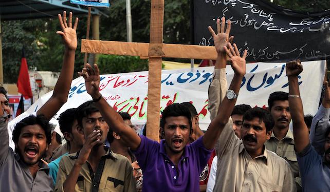 epa04482446 Pakistani members of the Christian minority shout slogans during a protest against the killing of a Christian couple who were burnt alive for alleged blasphemy, in Kot Radha Kishan, in Karachi, Pakistan, 09 November 2014. An angry mob on 05 November, burnt alive Shahzad Masih and his wife Shama Shahzad, a Christian couple in a village in Kot Radha Kishan for allegedly desecrating the Muslim holy book the Koran, police said, in another incident highlighting persecution of religious minorities. Police have arrested around 50 people after the provincial chief minister ordered an investigation into the incident, police said.  EPA/SHAHZAIB AKBER