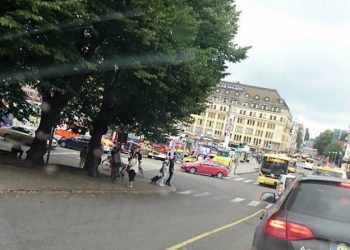 Turku Market Square on Friday, Aug. 18, 2017, with a yellow ambulance on the corner of the square (behind red car). Police in Finland say they have shot a man in the leg after he was suspected of stabbing several people in the western city of Turku. (Lehtikuva via AP)