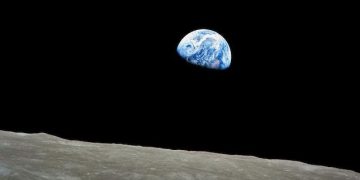 epa04000723 A handout picture released by NASA on 25 December 2013 shows a view of planet Earth seen from the Moon, at space, 24 December 1968. The Apollo Eight crew flew from Earth to the Moon and back again. Frank Borman, James Lovell, and William Anders were launched atop a Saturn V rocket on 21 December 1968, circled the Moon ten times in their command module, and returned to Earth on 27 December 1968. The Apollo Eight mission's impressive list of firsts includes: the first humans to journey to the Earth's Moon, the first to fly using the Saturn V rocket, and the first to photograph the Earth from deep space. As the Apollo Eight command module rounded the far side of the Moon on 24 December 1968, the crew could look toward the lunar horizon and see the Earth appear to rise, due to their spacecraft's orbital motion. Their famous picture of a distant blue Earth above the Moon's limb was a marvelous gift to the world.  EPA/NASA  HANDOUT EDITORIAL USE ONLY