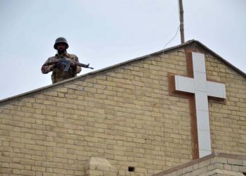 epaselect epa06405320 A Pakistani soldier stands guard at Methodist Church, that was attacked a week earlier by Islamic State (IS) militants, as the Christians minority celebrate Christmas, in Quetta, Pakistan, 25 December 2017. Pakistani Christians were celebrating Christmas Eve Sunday with mass and processions under heavy security, amid fear and challenge of extremists, following a recent attack at a church killing nine people and injuring 57 in the western part of the country. Pakistan is a Sunni Muslim-majority country, with 4 million Christians out of a total population of around 200 million residents.  EPA/STR