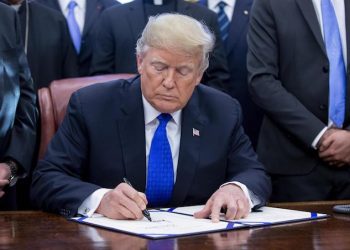 epa07224609 US President Donald J. Trump signs H.R. 390, the 'Iraq and Syria Genocide Relief and Accountability Act of 2018', in the Oval Office of the White House in Washington, DC, USA, 11 December 2018. The law will provide emergency humanitarian and recovery assistance to victims of crimes against humanity, war crimes and genocide in Iraq and Syria. The legislation also directs the US State Department to preserve evidence of genocide in those regions.  EPA/MICHAEL REYNOLDS