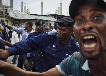 epa07275655 Police officers try to control supporters of DR Congo's defeated opposition candidate for the Presidential election Martin Fayulu after the rally in Kinshasa, Democratic Republic of the Congo, 11  January 2019. Another opposition candidate Felix Tshisekedi, the leader of the Union for Democracy and Social Progress (UDPS) party, was declared the winner on 10 January of the fraught elections. Fayulu has vowed to contest the result in court, according to reports.  EPA/HUGH KINSELLA CUNNINGHAM