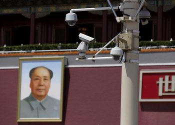 epa04827480 Surveillance cameras near a Mao Zedong portrait in Tiananmen Square, Beijing city, China, 02 July 2015.  China's legislature adopted a new national security law on 01 July 2015 that covers a wide spectrum of topics including defense, science and technology, finance, culture and religion.  EPA/WU HONG