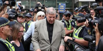 epa07397776 Cardinal George Pell (C) leaves the County Court in Melbourne, Australia, 26 February 2019. Australia's most senior Catholic Cardinal George Pell was found guilty on five charges of child sexual assault after an unanimous verdict on 11 December 2018, the results of which were under a suppression order until being lifted on 26 February 2019.  EPA/DAVID CROSLING AUSTRALIA AND NEW ZEALAND OUT