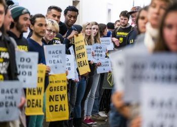 epa07222254 Supporters of Representative elect Ocasio-Cortez's proposed Select Committee on a 'green New Deal' rally outside the office of Democratic Congressman from Maryland and House Minority Whip Steny Hoyer in the Longworth House Office Building in Washington, DC, USA, 10 December 2018. The rally was organized by Sunrise, a 'movement to stop climate change and create millions of good jobs in the process.' Dozens of activists were arrested during their action.  EPA/JIM LO SCALZO