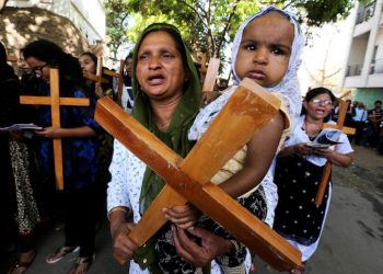 epa06637087 Indian Christian devotees carry wooden crosses while participating in a religious procession on the occasion of Good Friday in Bhopal, India, 30 March 2018. It is the one of the highest religious holidays observed by Christians all over the world, commemorating the crucifixion of Jesus Christ and his death at Golgotha.  EPA/SANJEEV GUPTA