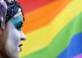 epa05311531 An activist of the lesbian, gay, bisexual and transgender†(LGBT) movement named 'Sister†Dominique' in front of a rainbow flag during an event held in front of the state parliament in†Potsdam, Germany, 17 May 2016. The rainbow flag is flying in front of the Brandenburg state parliament on the same day. The flag has been popularised worldwide as a symbol of the LGBT†movement.  EPA/RALF†HIRSCHBERGER