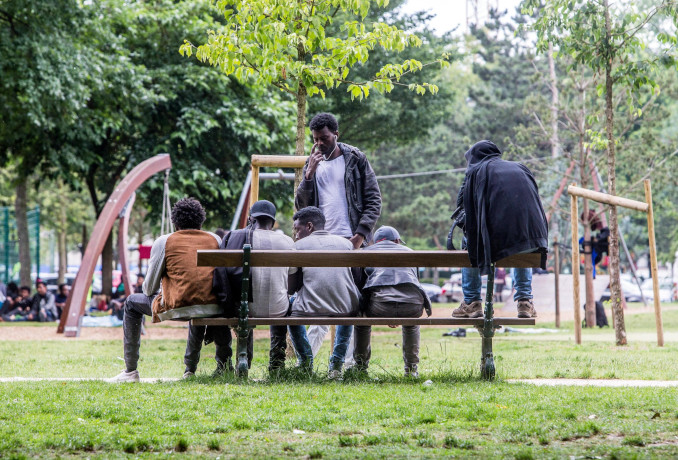 Immigrati in un parco di Bruxelles