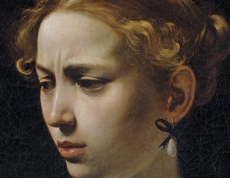 Caravaggio, Giuditta decapita Oloferne (particolare: il volto di Giuditta)