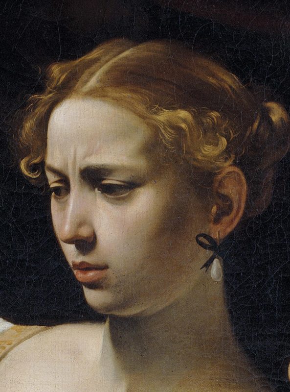 Caravaggio, Giuditta decapita Oloferne (particolare: il volto di Giuditta)