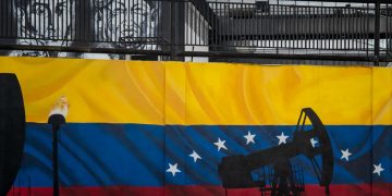 Murale con bandiera del Venezuela e petrolio